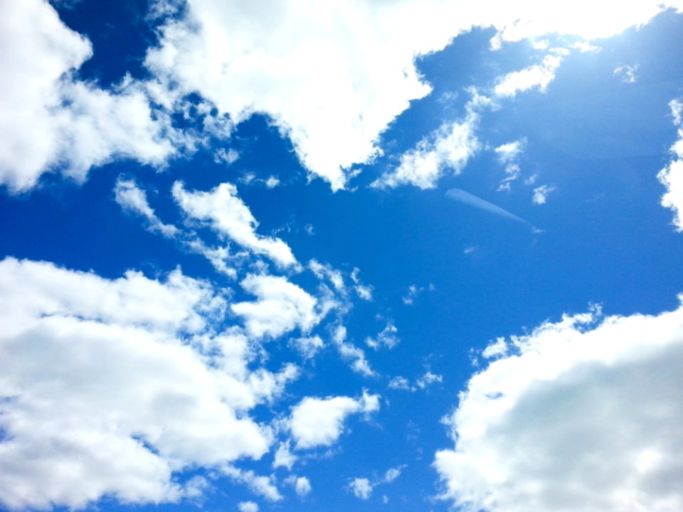 Blue Sky With Puffy White Clouds