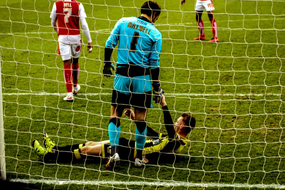 Soccer Players In Net