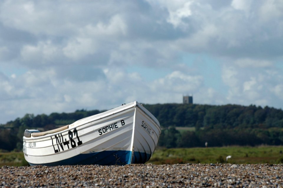 Wooden Boat On Beach