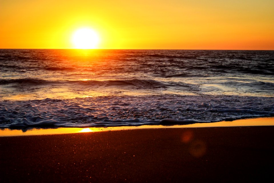 Sunset Over Sandy Beach photo