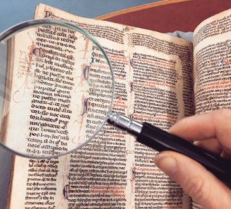 Magnifying Glass Over Antique Book