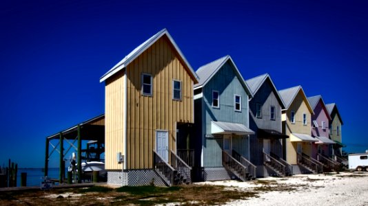 Inline House Near Seashore During Daytime