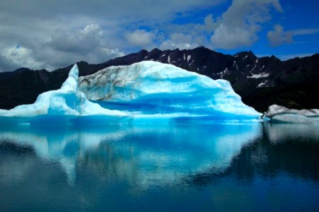 Scenic View Of Frozen Lake Against Blue Sky photo