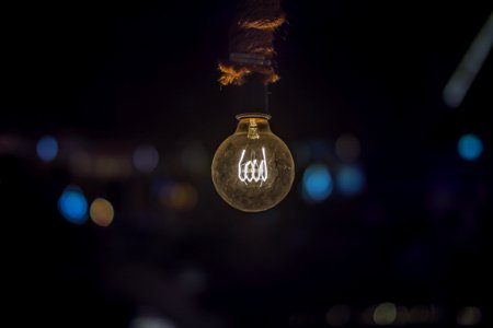 Close-up Of Illuminated Light Bulb photo