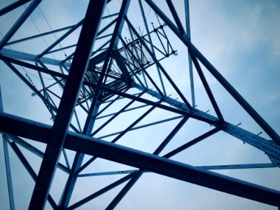 Low Angle View Of Electricity Pylon Against Sky photo