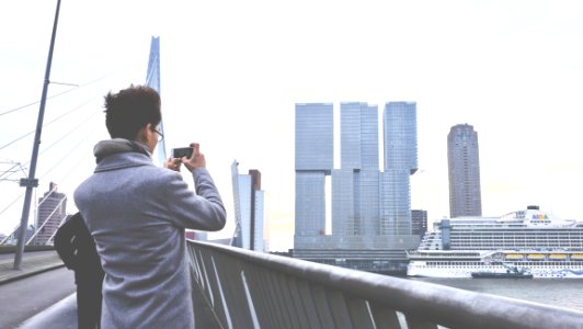 Rear View Of Man Photographing Cityscape