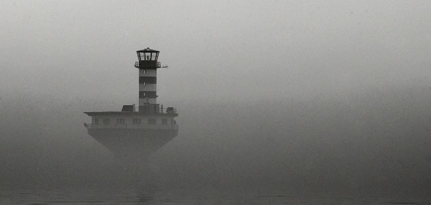 Lighthouse In The Mist