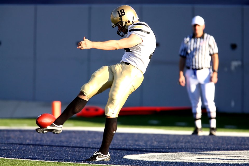 American Football Kicking The Ball