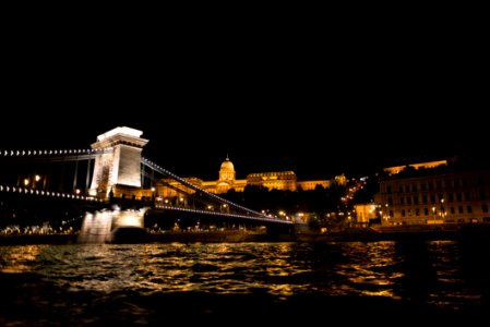 Castle And Bridge Over Danube River At Night photo
