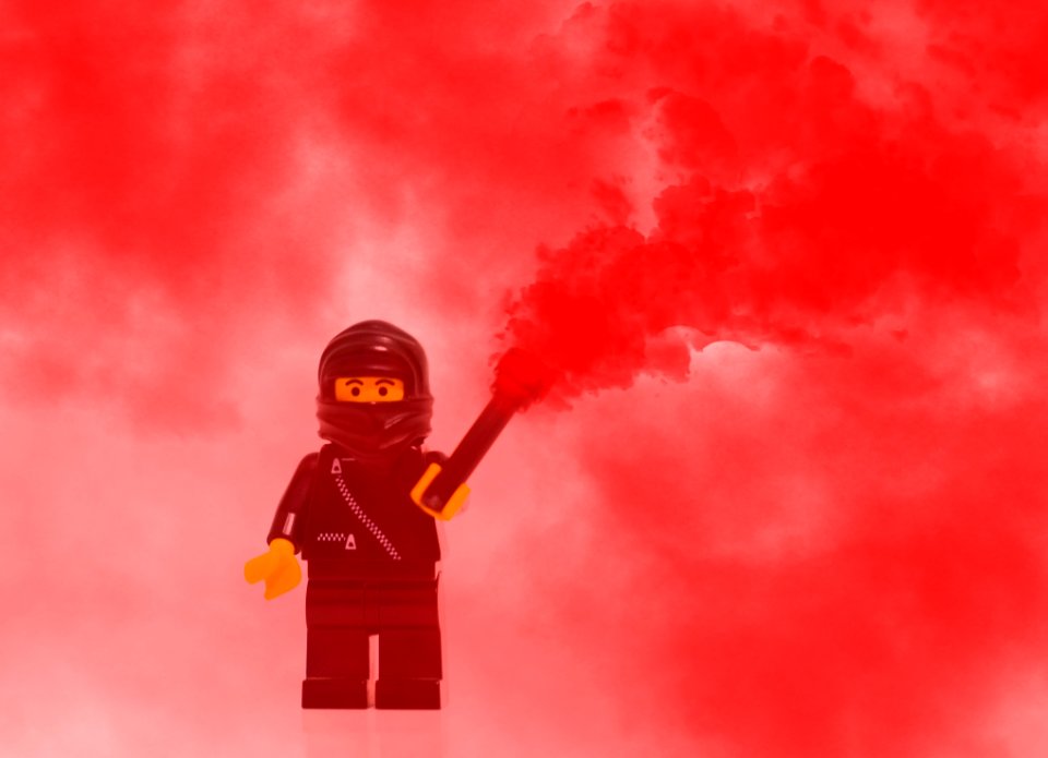 Lego Mini Figure Character In Red Smoke
