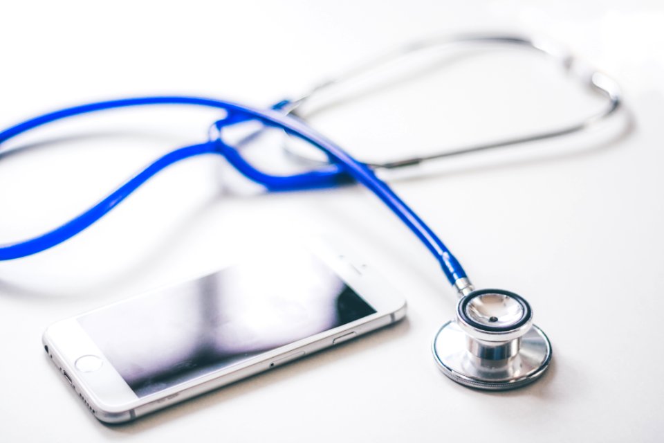 Silver Iphone 6 Near Blue And Silver Stethoscope