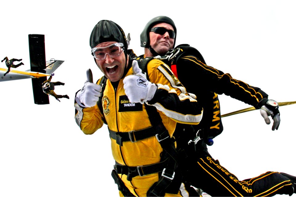 Man In Yellow Jumpsuit And Man In Black Jumpsuit Sky Diving
