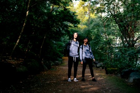 Rear View Of Couple Walking In Forest photo