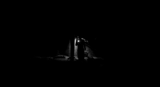 Low Angle View Of Man Standing At Night