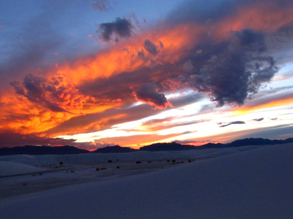 Sunset Skies Over Snowy Landscape photo
