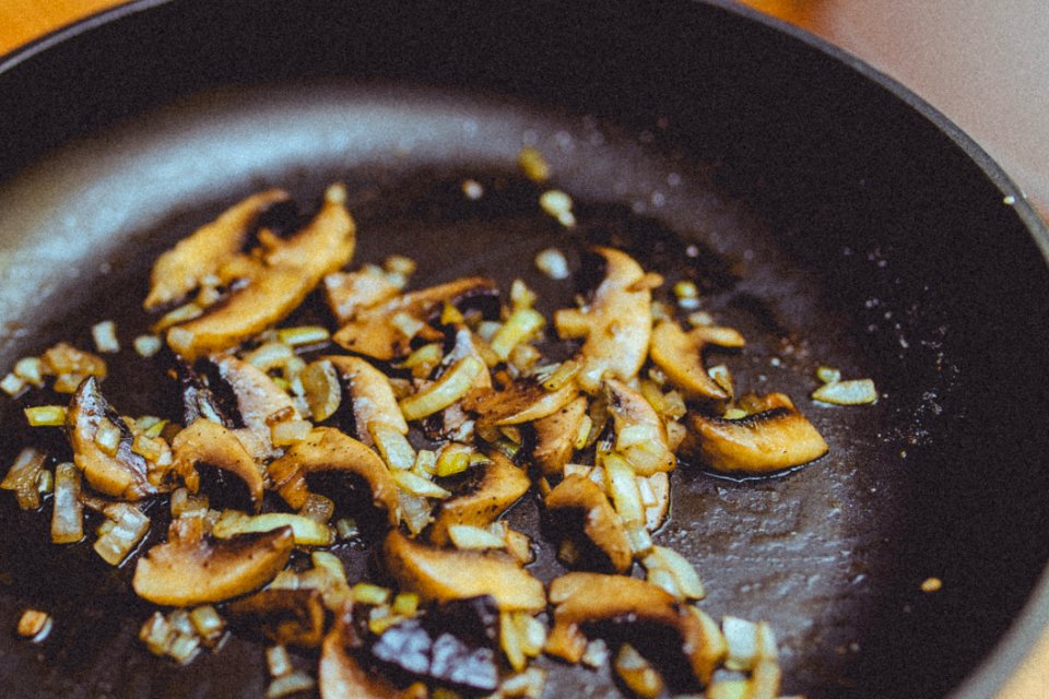 Onions And Mushrooms Frying In Pan