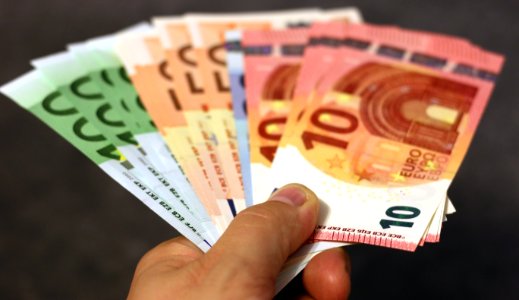 Hand Holding Euro Notes photo