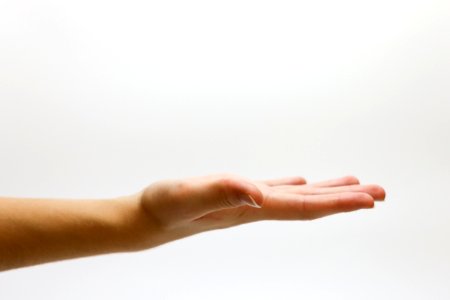 Close-up Of Hand Over White Background photo