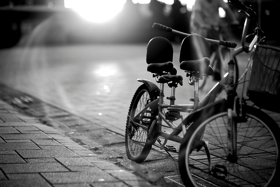 Tandem Bicycle On Sidewalk In Greyscale Photography