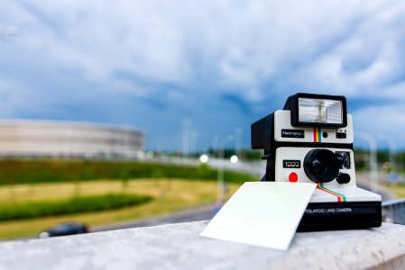 Black And White Polaroid Instant Camera With Photo Paper photo