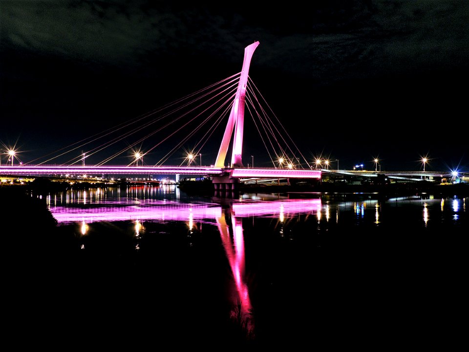 Illuminated Bridge At Night