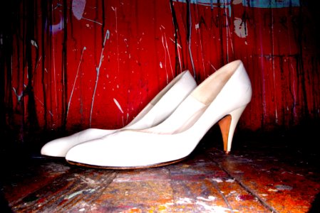 White Womens Shoes On Red Background
