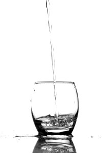 Close-up Of Water Pouring In Glass photo