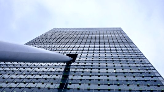 Close-up Of Modern Office Building Against Sky