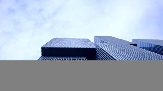 Low Angle View Of Office Building Against Sky photo