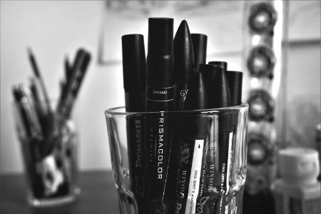 Close-up Of Markers On A Container