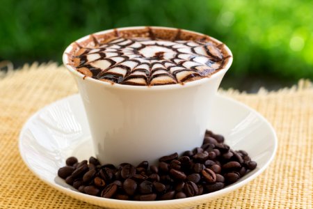 Decorative Cup Of Coffee With Beans photo