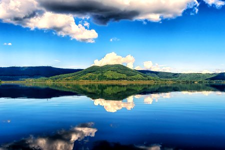 Clouds Reflecting On Blue Lake photo