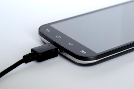 Black Android Smartphone Charge On photo