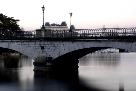 Grey Bridge With Light Post Under White Sky During Daytime photo