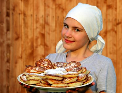Woman In Grey Crew Neck Shirt Holding A White Ceramic Plate With Pancakes