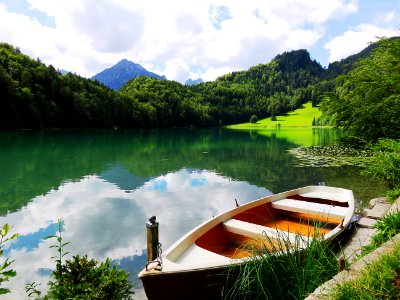 Boat Near Lake In The Mountains photo