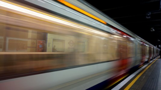 Blurred Motion Of Train At Railroad Station photo