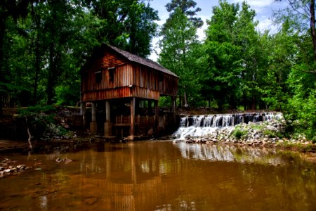 Landscape Photography Of Brown Wooden House On Forest Near River photo