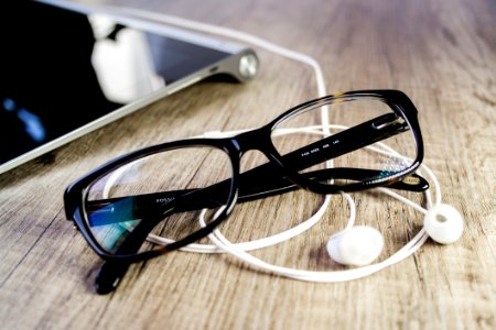 Close-up Of Eyeglasses On Table photo