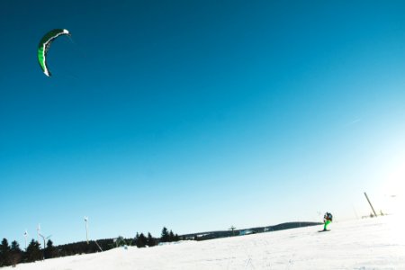 Man Skiing On Snow Covered Landscape photo