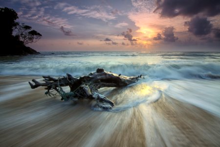 Scenic View Of Sea Against Dramatic Sky