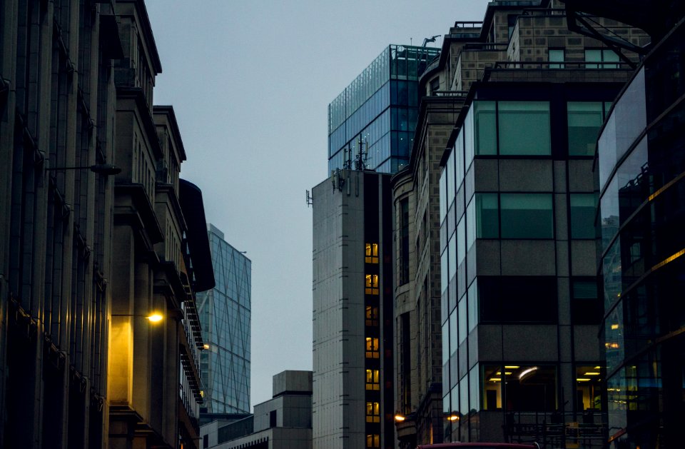 Dusk On A Street With Tall Buildings