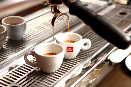 Cups Of Espresso Below Espresso Machine photo