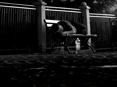 Man Asleep On Park Bench photo