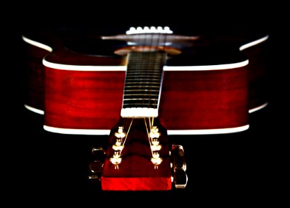 Close Up Photography Of Red Wooden Guitar Head Stock