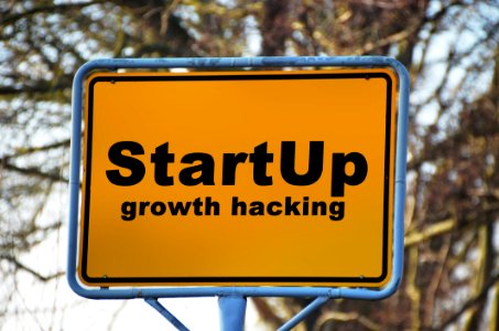 Yellow And Black Start Up Growth Hacking Signage