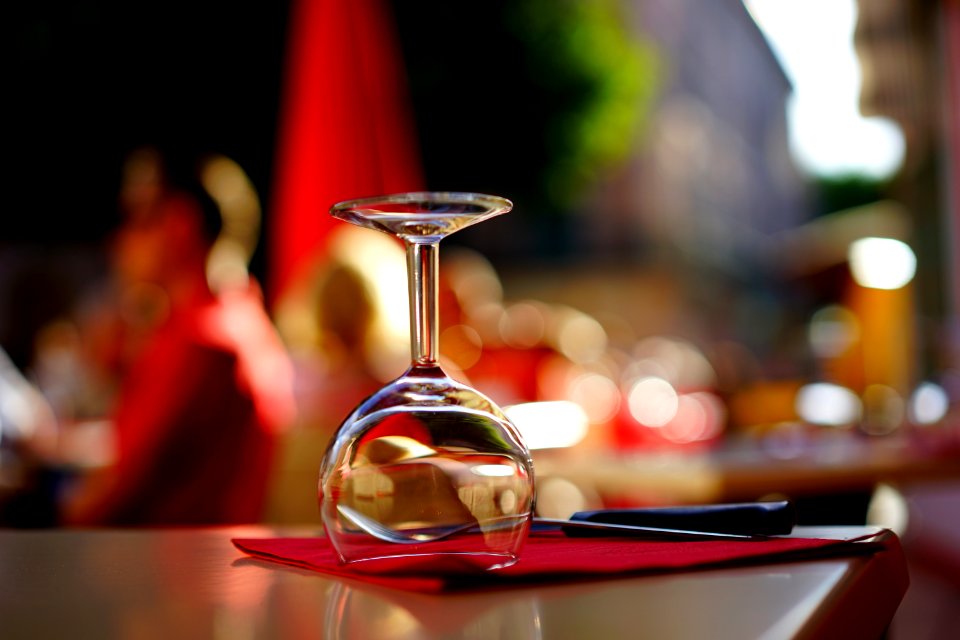Clear Wine Glass On Top Of Brown Table