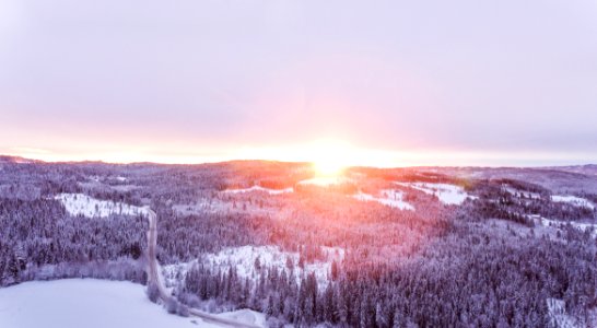 Sunset Over Forests In Hillside In Winter