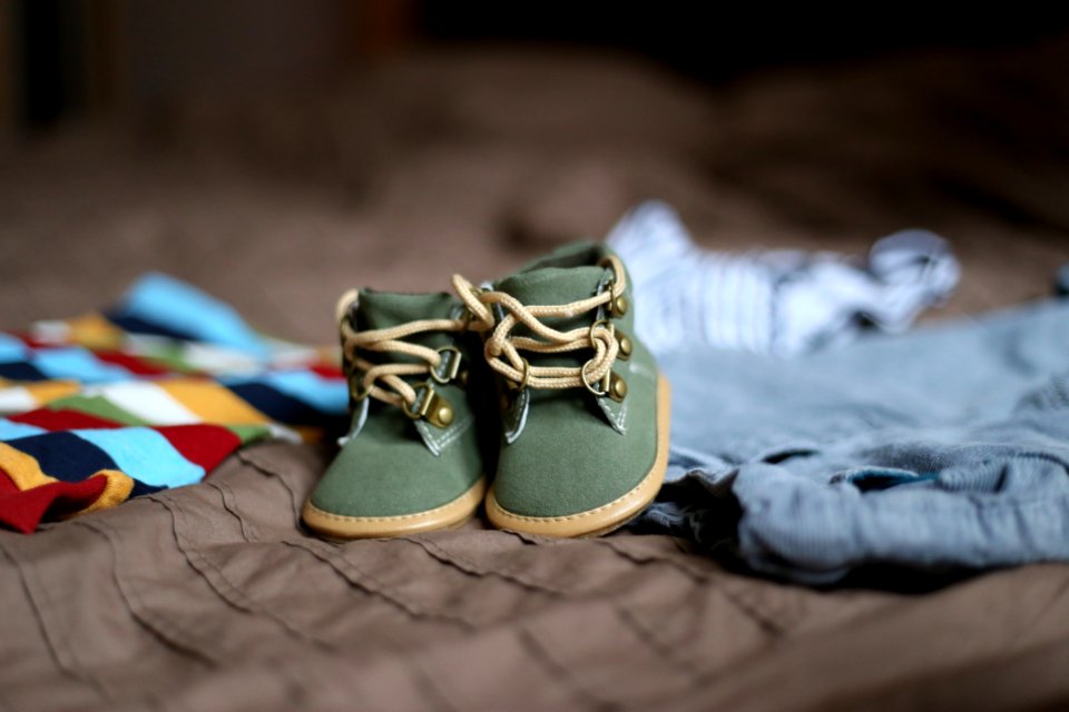 Babys Green And Beige Sneakers On Brown Textile