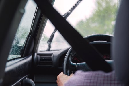 Hand Holding Steering Wheel photo